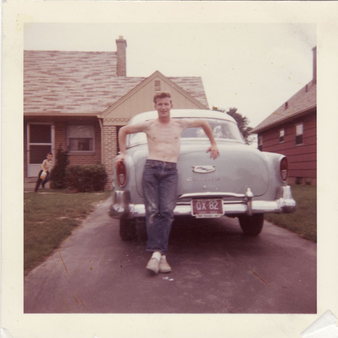 Brian McDaniels, 18, stands in front of his 1954 Chevy Bel Air.