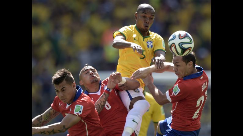 From left: Chile's Eduardo Vargas, Chile's Arturo Vidal, Brazil's Marcelo and Chile's Marcelo Diaz vie for the ball.