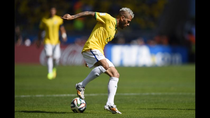 Brazilian defender Dani Alves controls the ball.