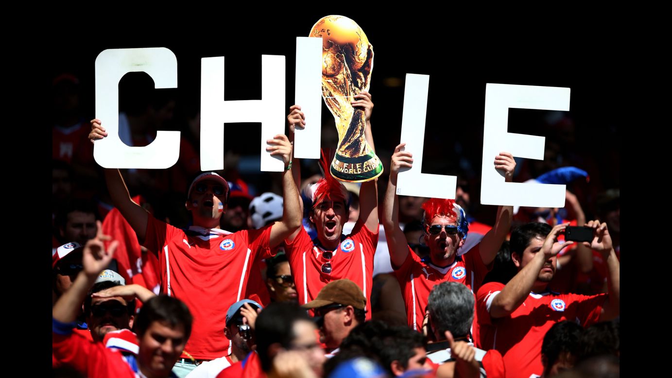 Chile supporters cheer together at Mineirao Stadium in Belo Horizonte, Brazil.