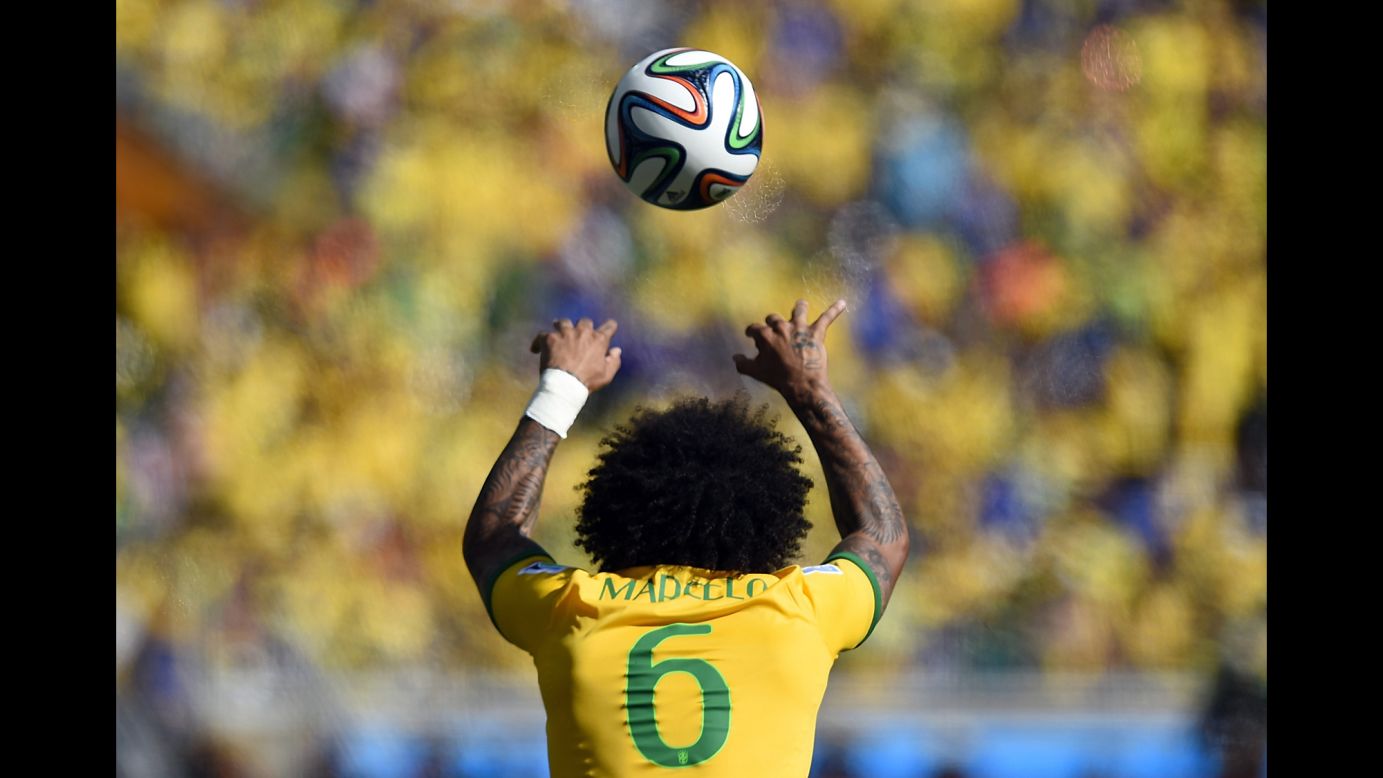Brazil's defender Marcelo throws the ball in during the game.