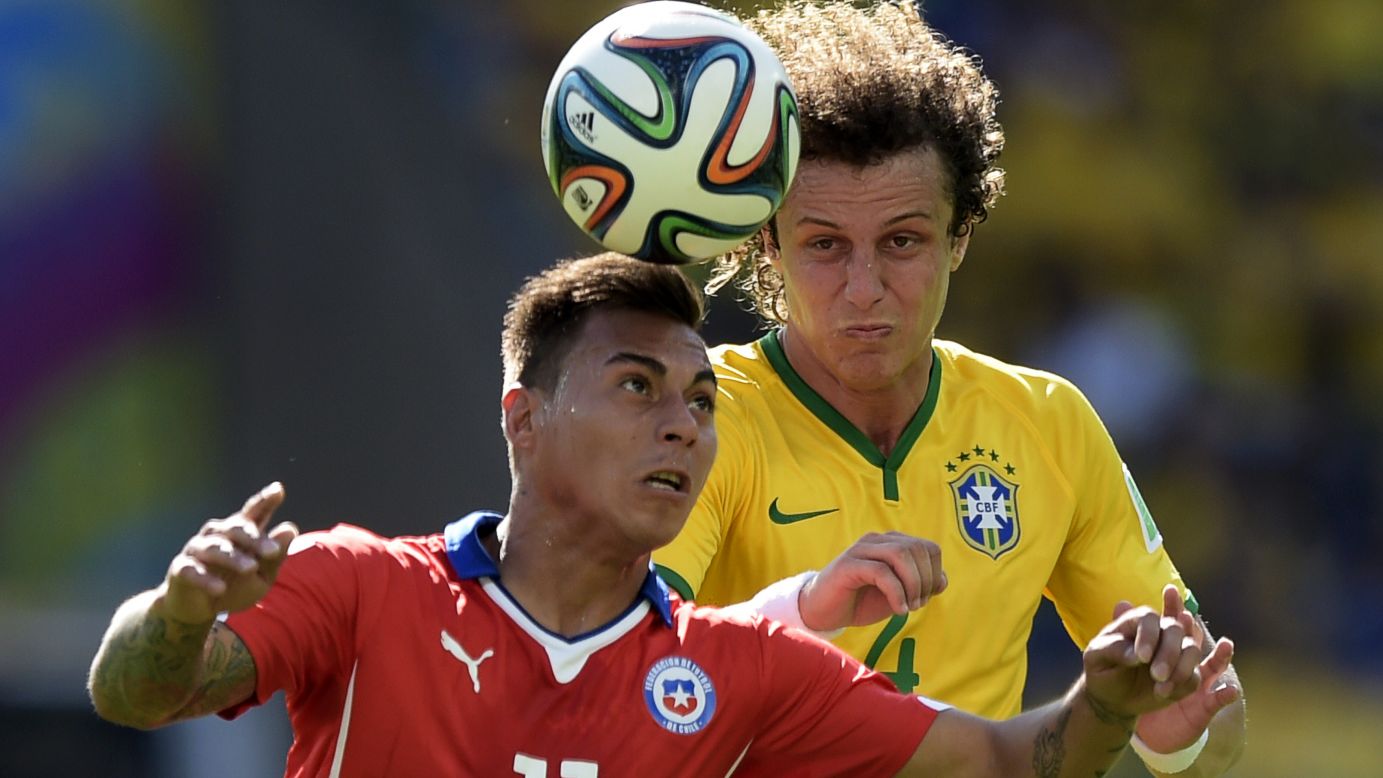 Chile's Jorge Valdivia and Brazil's David Luiz vie for the ball.