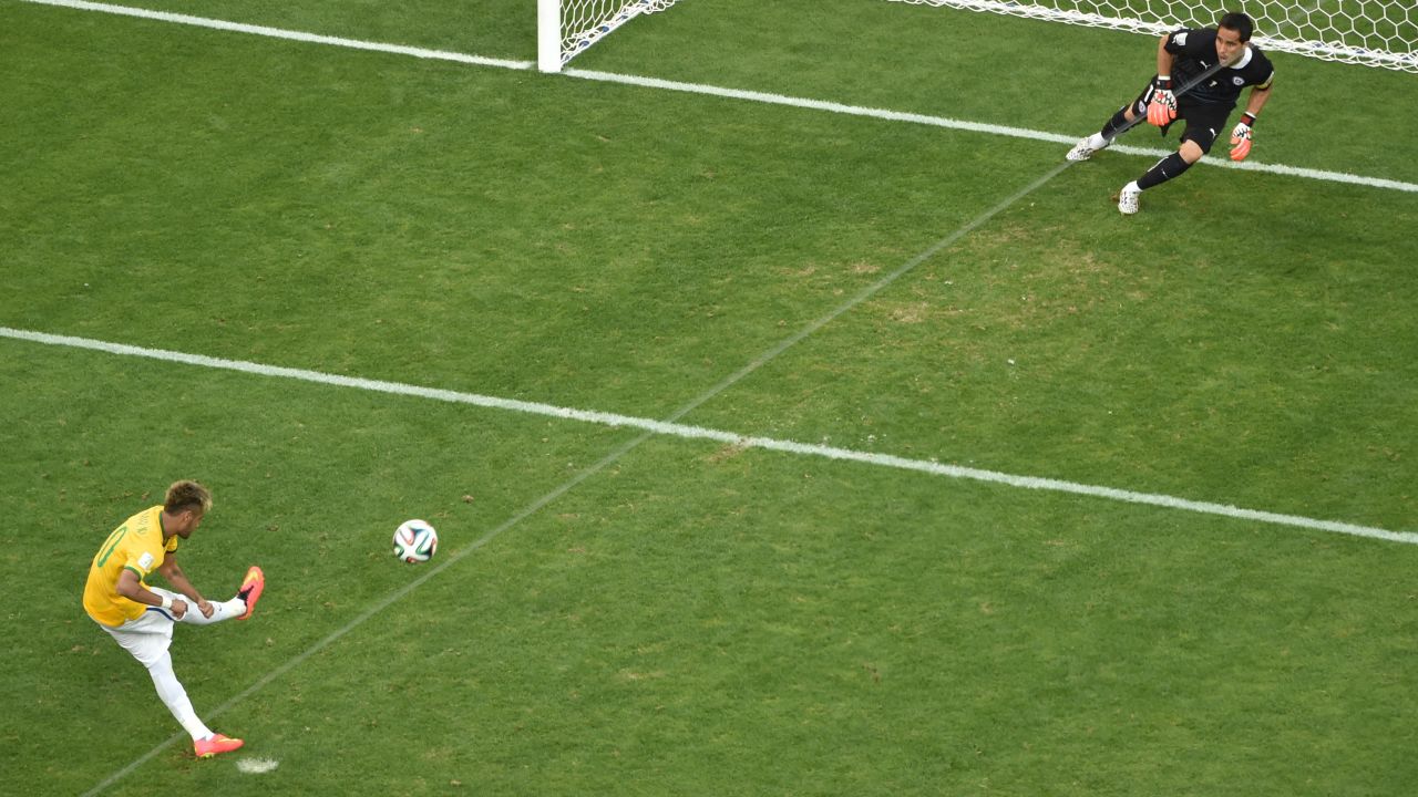 Brazil's Neymar scores during the penalty shootout.