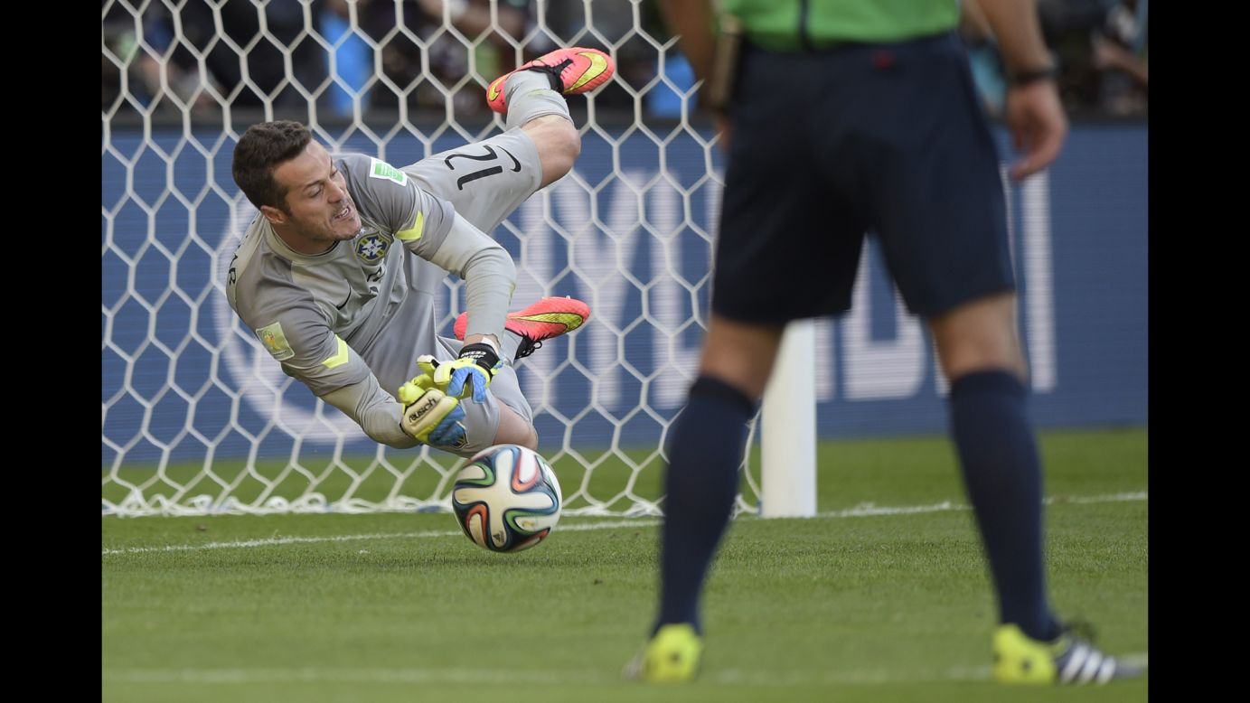 Brazil's goalkeeper Julio Cesar makes a save during the penalty shootout.