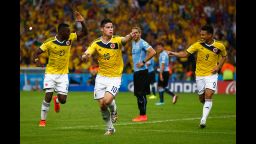 James Rodriguez of Colombia, center, celebrates scoring his team's second goal and his second of the game. Rodriguez set the record of most goals by one player in this World Cup with five goals to his name.