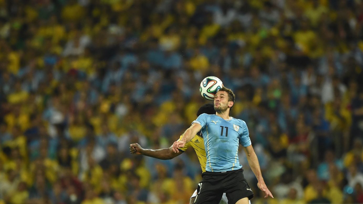Uruguay's forward Christian Stuani heads the ball.