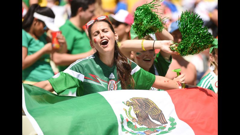 Mexican supporters cheer for their team before the game. <a href="index.php?page=&url=http%3A%2F%2Fwww.cnn.com%2F2014%2F06%2F28%2Ffootball%2Fgallery%2Fworld-cup-0628%2Findex.html" target="_blank">See the best World Cup photos from June 28.</a>