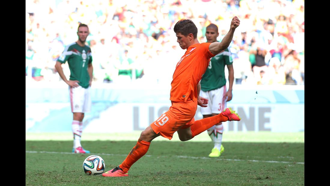 Klaas-Jan Huntelaar of the Netherlands shoots and scores his team's second goal on a stoppage-time penalty kick during a World Cup game against Mexico in Fortaleza, Brazil, on June 29. The Netherlands won 2-1 to advance to the quarterfinals.