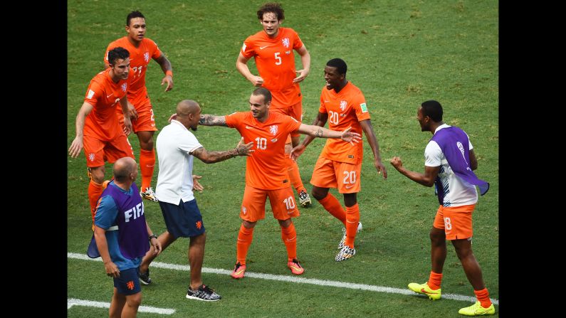 Wesley Sneijder of the Netherlands (No. 10) celebrates scoring his team's first goal against Mexico.