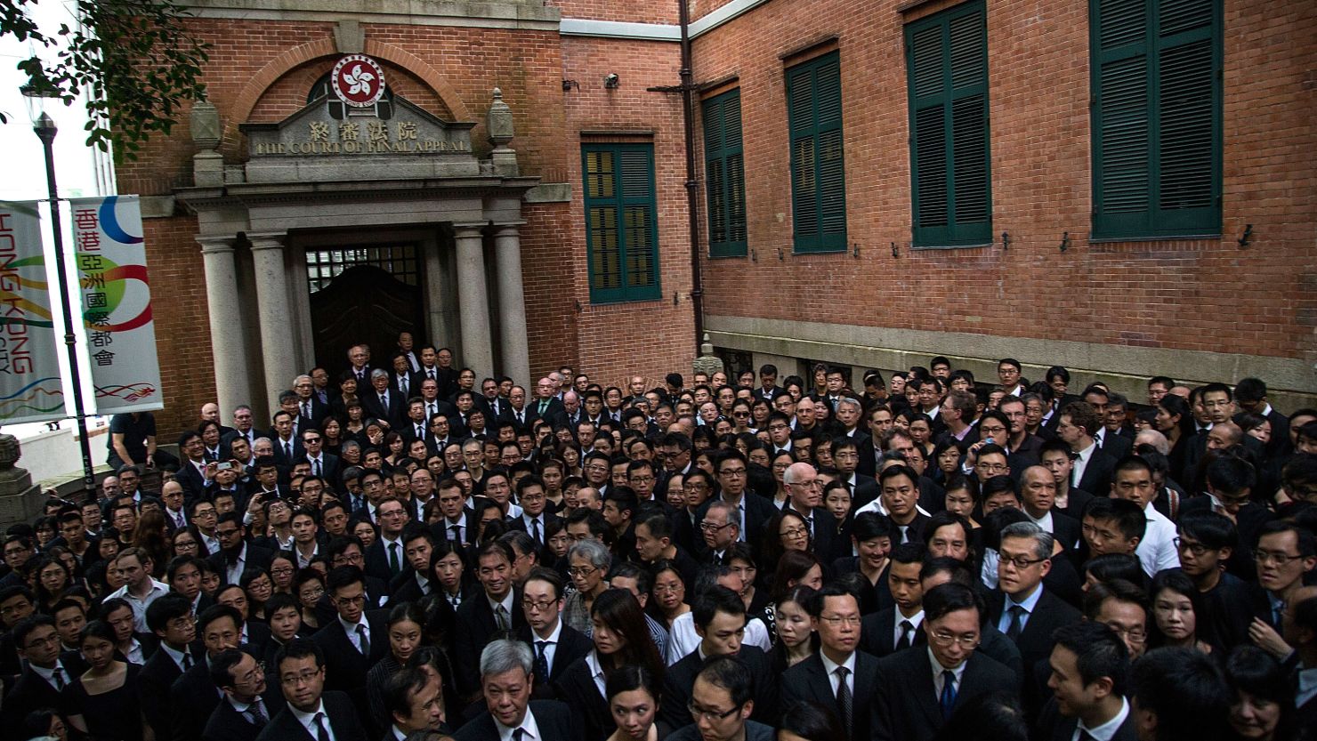 Hundreds of representatives from the legal sector take part in a silent march in Hong Kong, calling on Beijing to withdraw parts of the State Council's White Paper.