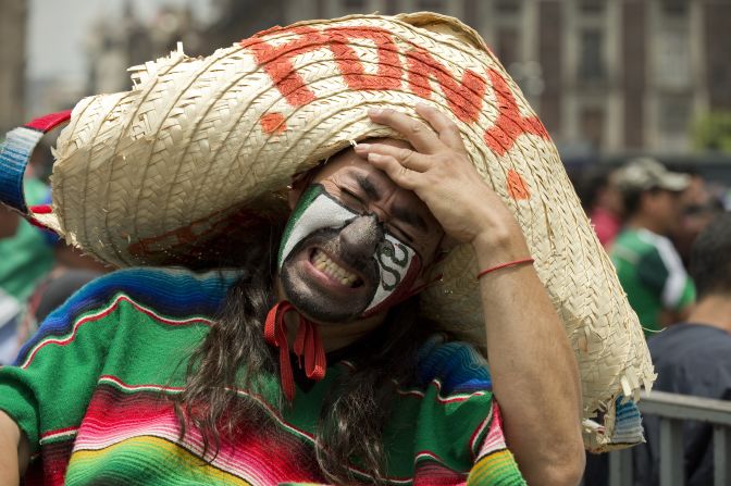 A Mexico fan shows his dejection at Zocalo Square in Mexico City after the national team lost to the Netherlands 2-1 in a round-of-16 match Sunday, June 29. 