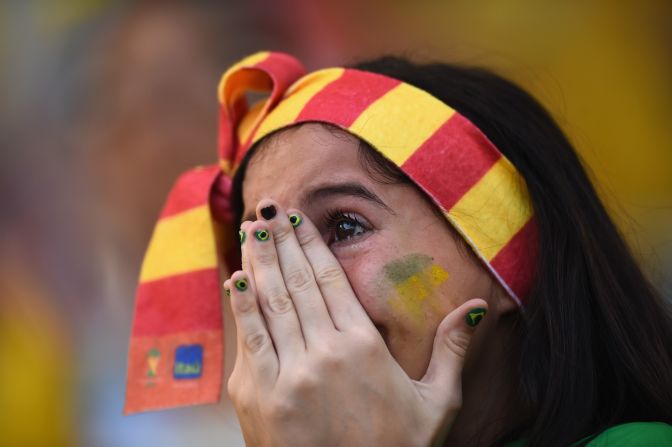 A fan in Rio de Janeiro shows her emotions as she watches the penalty shootout between Brazil and Chile on June 28. Brazil was victorious.