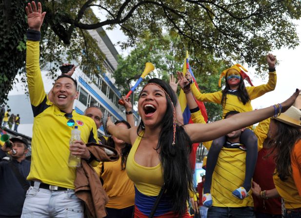 Fans in Bogota, Colombia, celebrate during the live broadcast of Colombia's World Cup win over Uruguay on Saturday, June 28.