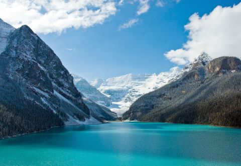 <strong>Lake Louise: </strong>An alpine lake with sparkling blue waters, Alberta's Lake Louise in Banff National Park sits at the base of a cluster of glacier-clad peaks. The lake offers paddling in summer and an outdoor skating rink in winter. 