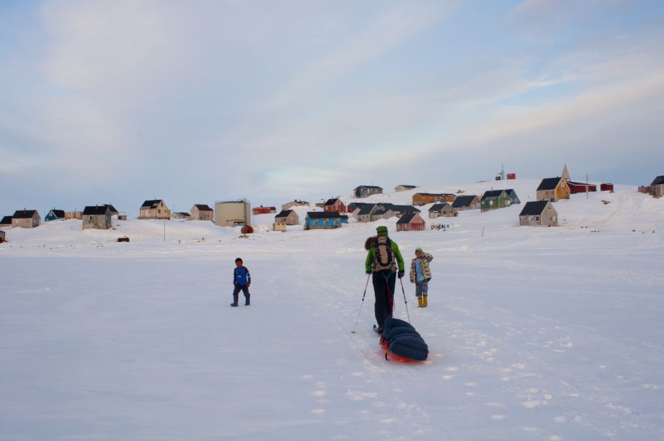 He completed the one-month trek across Greenland "in a tiny hunting village on the east coast ... where there are more dogs than people. I was greeted by two Inuit boys who wanted to drag my sled to the final house where we would take our first shower in a month."
