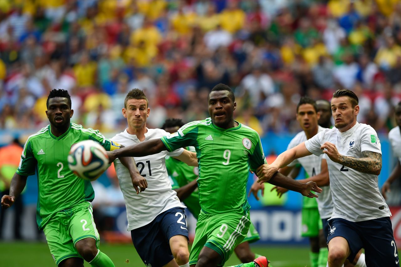 Yobo, left, and Nigerian forward Emmanuel Emenike, third left, chase after the ball near French defenders Koscielny, second left, and Mathieu Debuchy, far right.