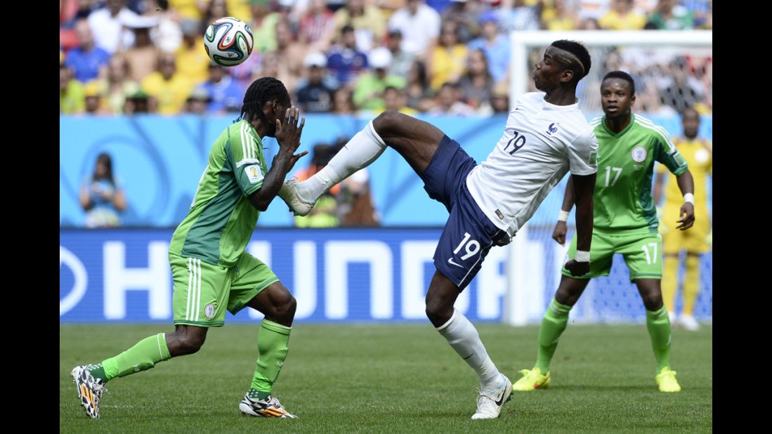 Pogba reaches for the ball near Nigeria's Victor Moses.