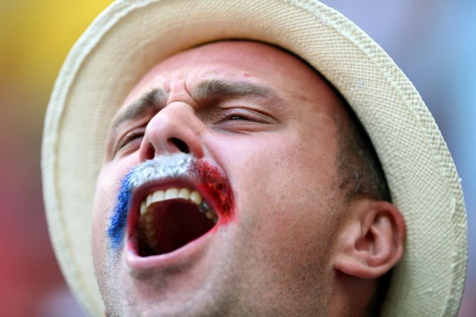 A France fan cheers before the game. <a href="index.php?page=&url=http%3A%2F%2Fwww.cnn.com%2F2014%2F06%2F29%2Ffootball%2Fgallery%2Fworld-cup-0629%2Findex.html">See the best World Cup photos from June 29</a>