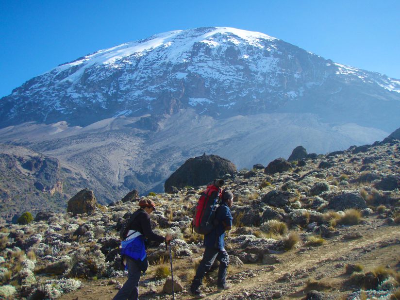 "I have always been an avid traveler as well, so it occurred to me that there would be no better way to see the planet and the people that live within it than by doing so on foot." Here Nanavati's hiking up Mount Kilimanjaro in Tanzania.
