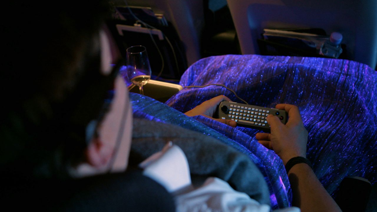 The 'happiness blanket' uses fiberoptic neuro-sensors to measure a person's brainwaves. It changes between red and blue, depending on how relaxed or tense the wearer is.