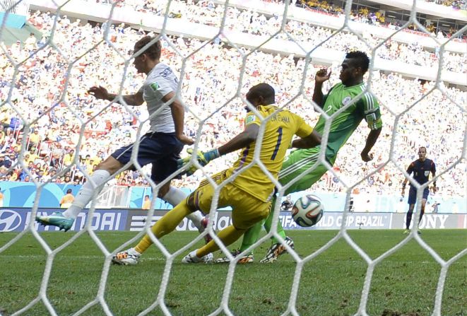 The ball hits Nigerian defender Joseph Yobo, right, before going into his own net during a World Cup match against France on June 30, in Brasilia, Brazil. France advanced to the quarterfinals with a 2-0 victory.