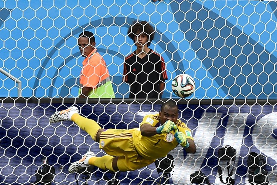 Nigeria's goalkeeper, Vincent Enyeama, punches the ball away from goal.