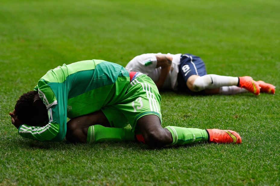 Oshaniwa and Valbuena lie on the field injured.
