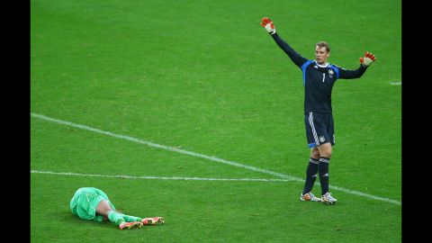 Islam Slimani of Algeria lies on the pitch next to goalkeeper Manuel Neuer of Germany during a World Cup match Monday, June 30, in Porto Alegre, Brazil. Although Algeria had a late goal, Germany still advanced to the quarterfinals with a 2-1 victory.