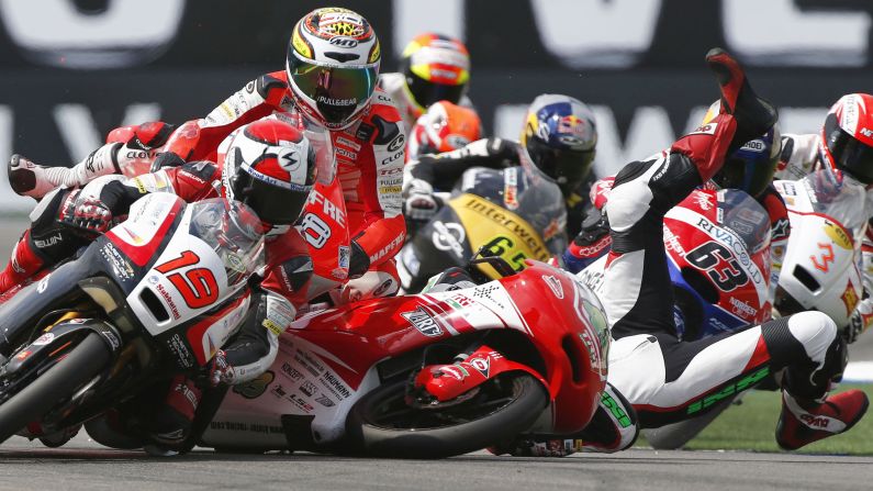 Luca Grunwald falls off his motorcycle after colliding with competitors during the final lap of a Moto3 race in Assen, Netherlands, on Saturday, June 28. He was not seriously hurt. In fact, he picked up his bike and pushed it over the finish line.