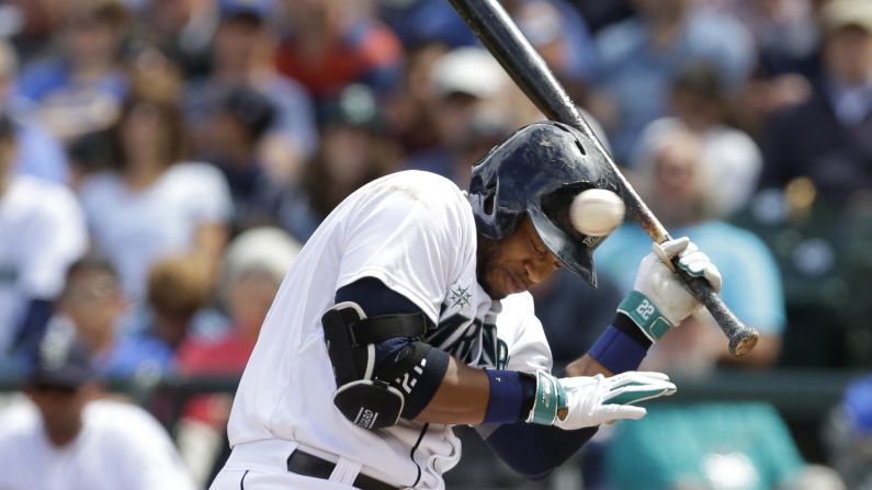 Robinson Cano of the Seattle Mariners ducks a pitch that was high and inside during a home game against Cleveland on Sunday, June 29.