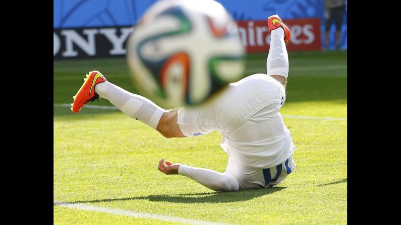England's Wayne Rooney falls to the ground during a World Cup match against Costa Rica on Tuesday, June 24, in Belo Horizonte, Brazil. It ended 0-0, and Costa Rica advanced to the knockout stage of the tournament while England went home.