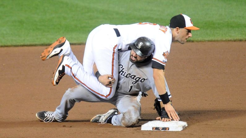 Adam Eaton of the Chicago White Sox slides under Ryan Flaherty of the Baltimore Orioles after Flaherty turned a double play in their Major League Baseball game Wednesday, June 25, in Baltimore.