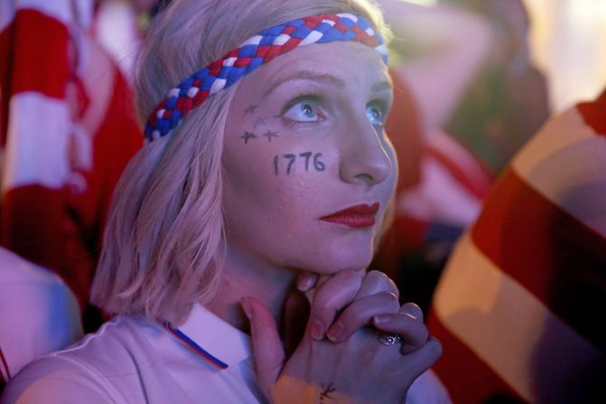 A U.S. fan watches nervously as the Americans surprisingly emerge from the group stage despite a nail-biting defeat against Germany.