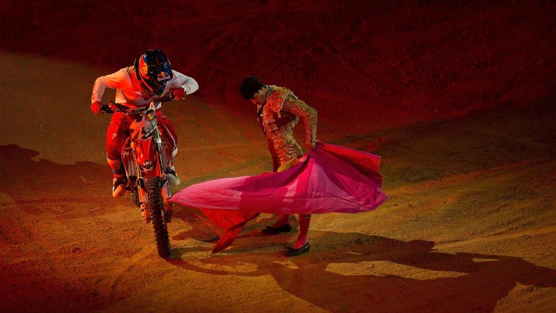 Motocross rider Josh Sheehan steers around a bullfighter at Madrid's Plaza de Toros during the Red Bull X-Fighters World Tour on Friday, June 27.