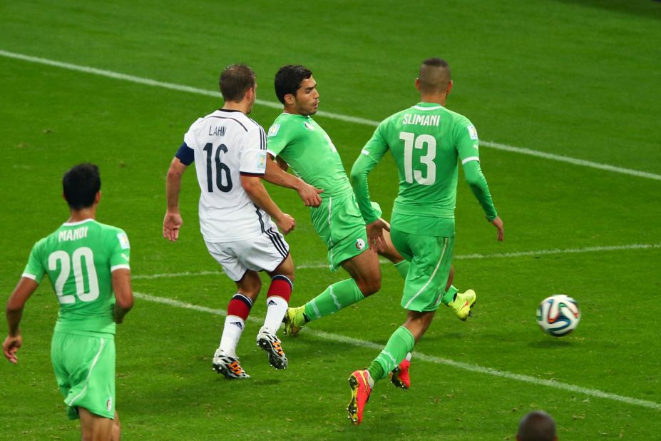 Abdelmoumene Djabou of Algeria shoots and scores his team's first goal in extra time during a World Cup round-of-16 match against Germany on Monday, June 30, in Porto Alegre, Brazil. Despite the late goal, Germany still advanced to the quarterfinals with a 2-1 victory.