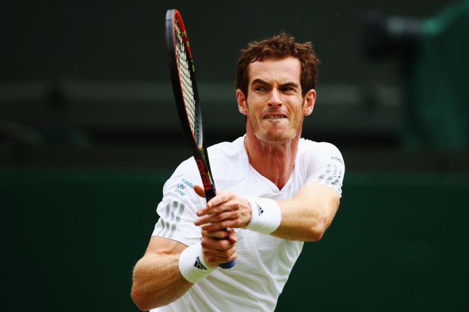 Andy Murray grimaces as he plays a backhand during his fourth round match against Kevin Anderson at Wimbledon. The defending champion won in straight sets 6-4 6-3 7-6 (8/6).