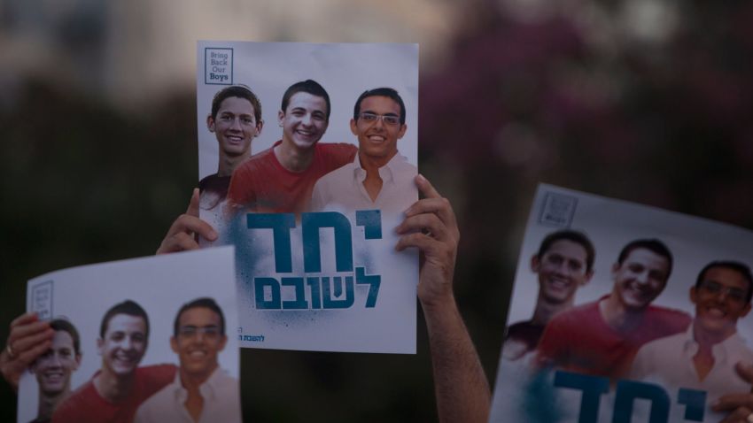 Israelis hold a poster showing the three missing Israeli teenagers, as they attend a rally under the slogan 'Bring Our Boys Home' on June 29, 2014 in Tel Aviv, Israel.Thousands of people gathered in Tel Aviv's Rabin Square on Sunday evening for a rally calling for the release of the three Israeli teens who were kidnapped more than two weeks ago. (Photo by Lior Mizrahi/Getty Images)