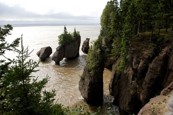 <strong>Bay of Fundy's Hopewell Rocks:</strong> Canada's Bay of Fundy in the Atlantic Ocean is home to the highest tides in the world. As a result, New Brunswick's incredible, eroded <a href="index.php?page=&url=http%3A%2F%2Fwww.thehopewellrocks.ca%2F" target="_blank" target="_blank">Hopewell Rocks</a> are covered in water twice a day. 