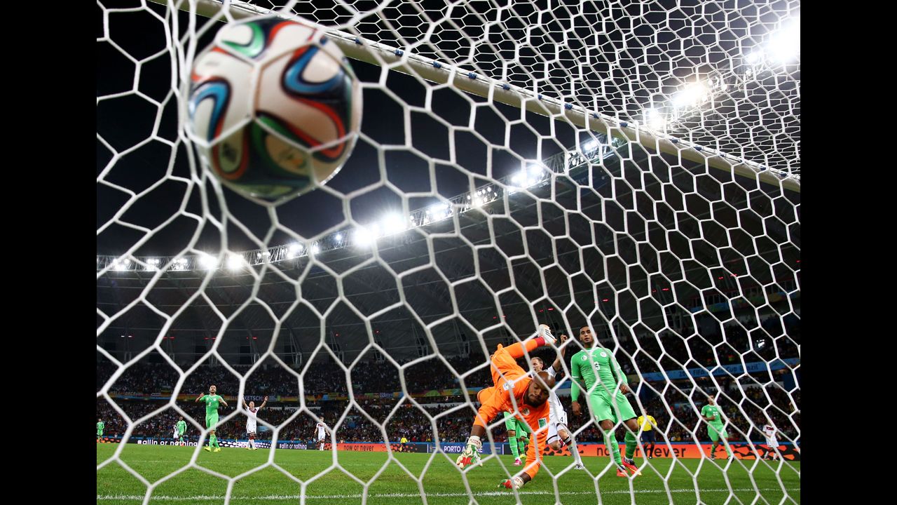 M'Bolhi of Algeria fails to save a shot by Schuerrle in extra time.