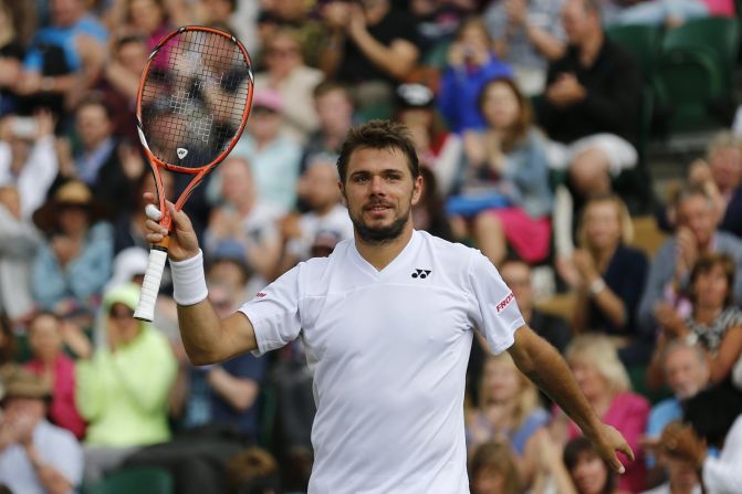Switzerland's Stanislas Wawrinka takes the applause after wrapping up his rain-affected third round match against Uzbekistan's Denis Istomin. The reigning Australian Open champion won 6-3 6-3 6-4. 