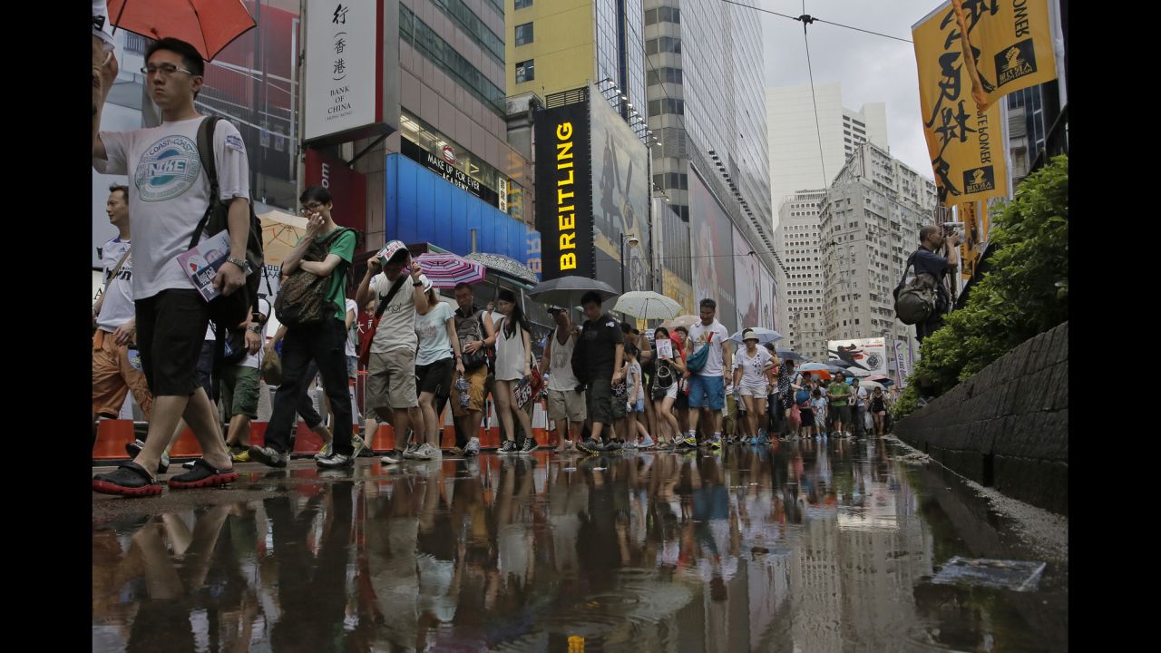 Rain poured down upon protesters intermittently throughout the day. 