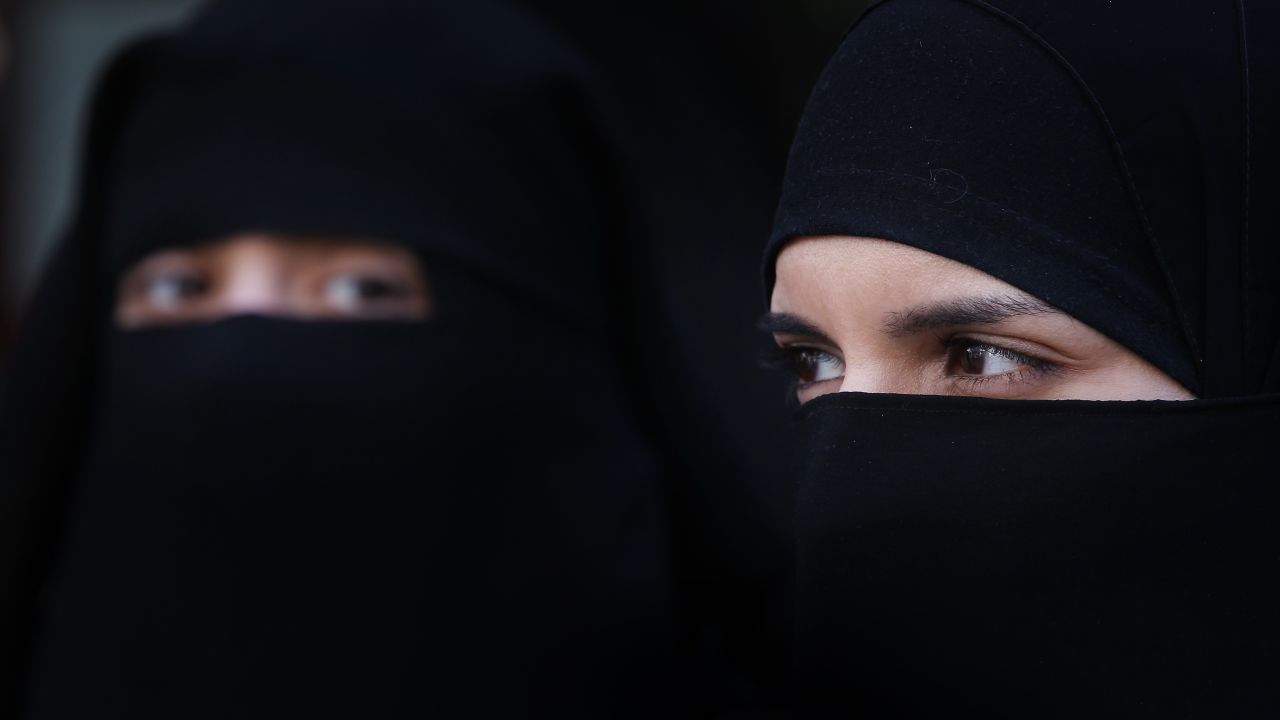 [File photo] Women wearing Islamic niqab veils stand outside the French Embassy in protest on April 11, 2011 in London, England. 