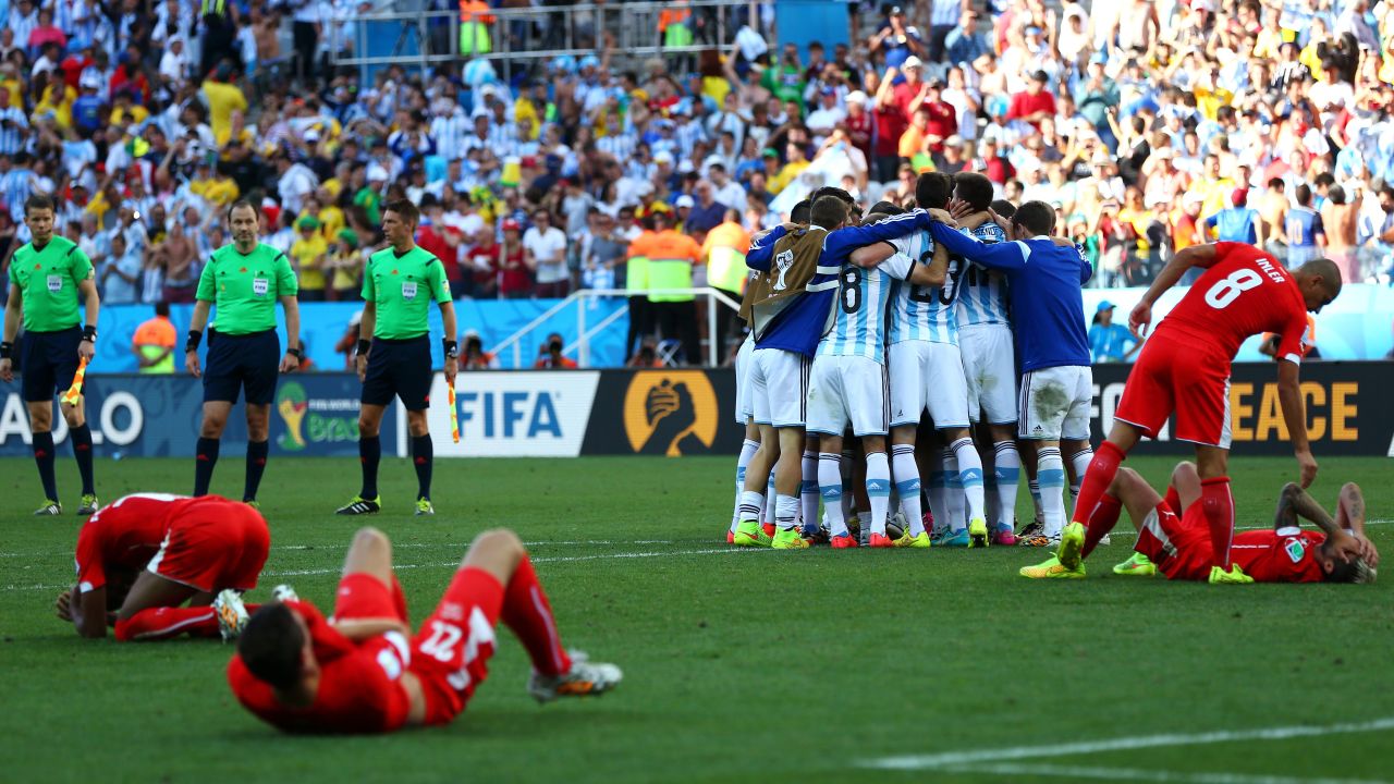 Argentina players celebrate in a huddle after they defeated Switzerland 1-0 in extra time during a World Cup round-of-16 match July 1 in Sao Paulo, Brazil.