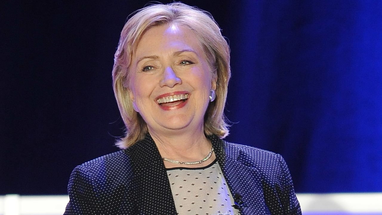Hillary Clinton was given a pair of running shoes, a reference to her possible run for the presidency in 2016.