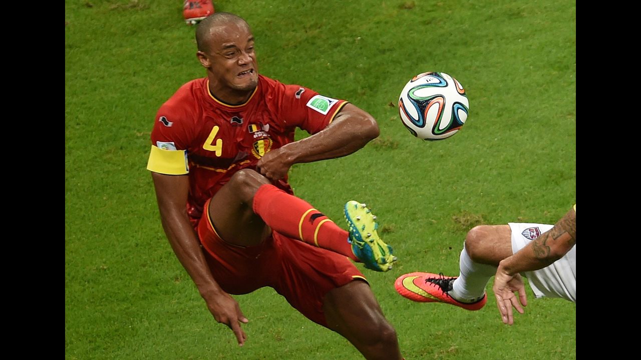 Kompany plays the ball during the first half.