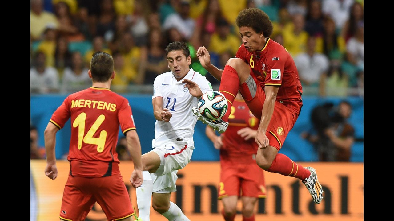 U.S. midfielder Alejandro Bedoya, center, vies for the ball with Witsel.