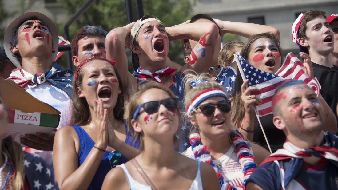 Fans in Washington react as they watch the match.