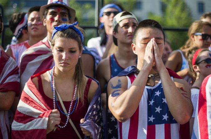 Fans in Washington react to the United States' loss to Belgium on July 1.