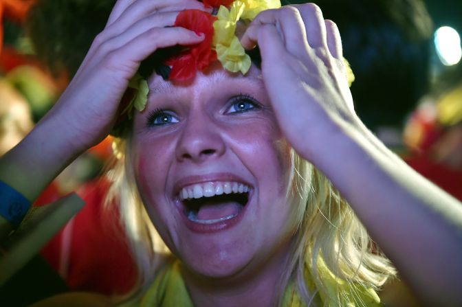 A Belgium fan reacts as she watches the round-of-16 match between Belgium and the United States from a FIFA Fan Fest viewing in Rio de Janeiro on Tuesday, July 1. Belgium won the match 2-1 in extra time. 