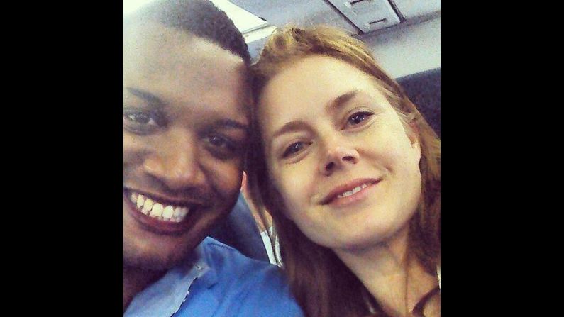 Journalist Ernest Owens <a href="https://twitter.com/MrErnestOwens/status/482588663121858560/photo/1" target="_blank" target="_blank">tweeted a selfie</a> with actress Amy Adams on Friday, June 27. "Told @InsideEdition why Amy Adams was classy for giving up her 1st class seat to the soldier sitting next to me!" he wrote.
